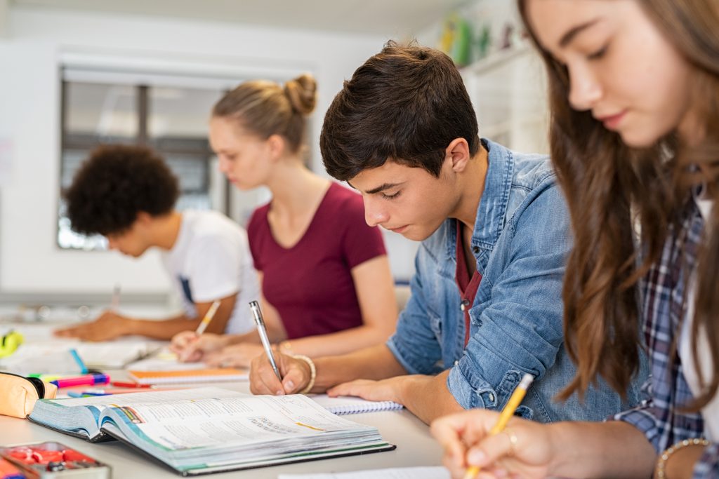 Kids in classroom writting