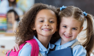two happy Catholic school students