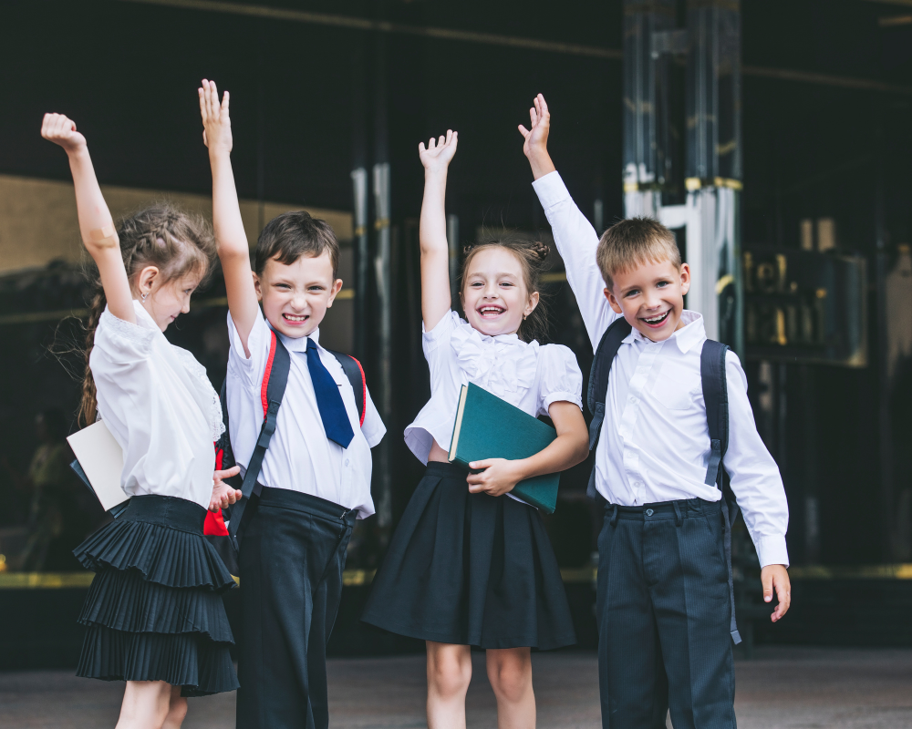 4 happy Catholic school students