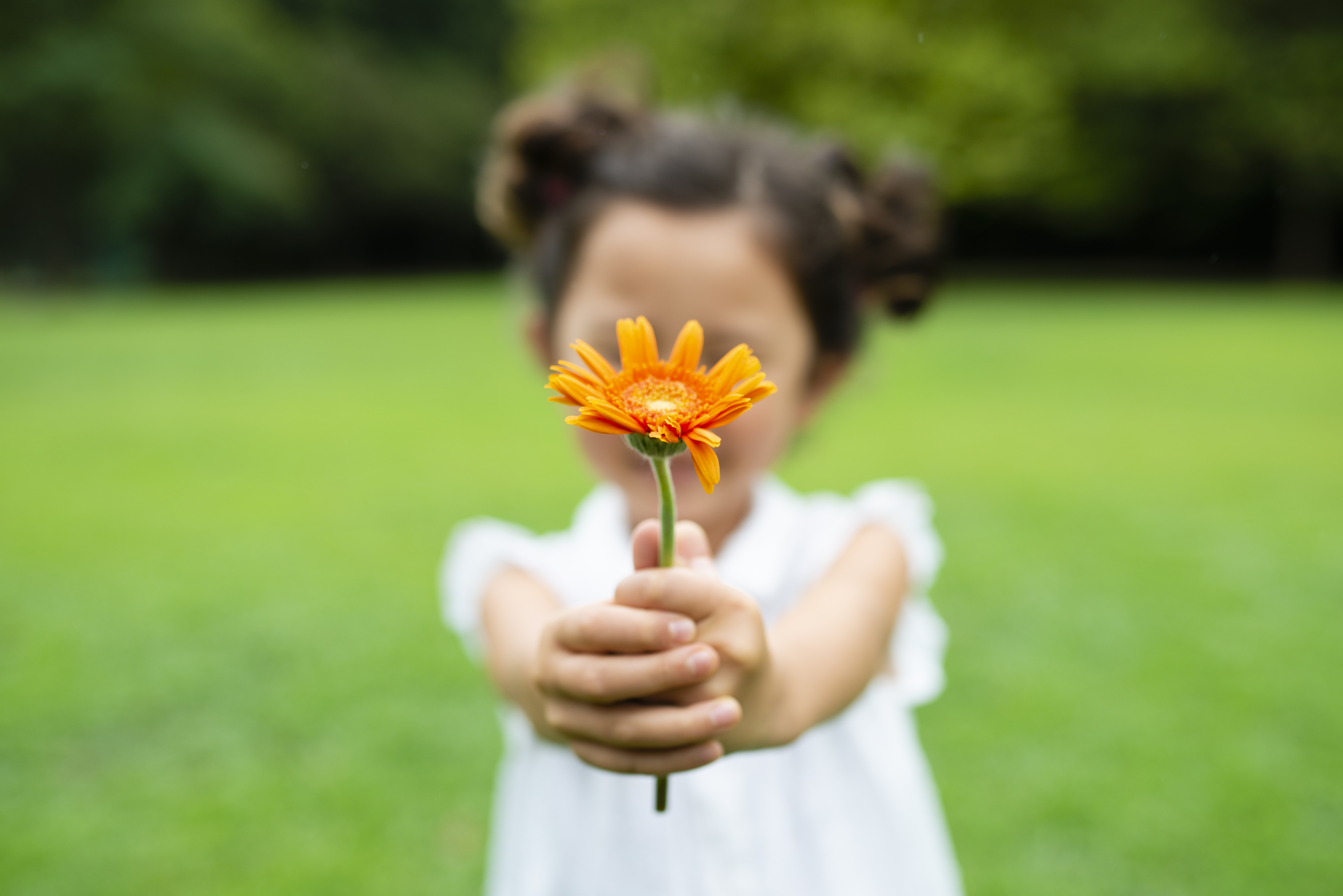 girl holding flower