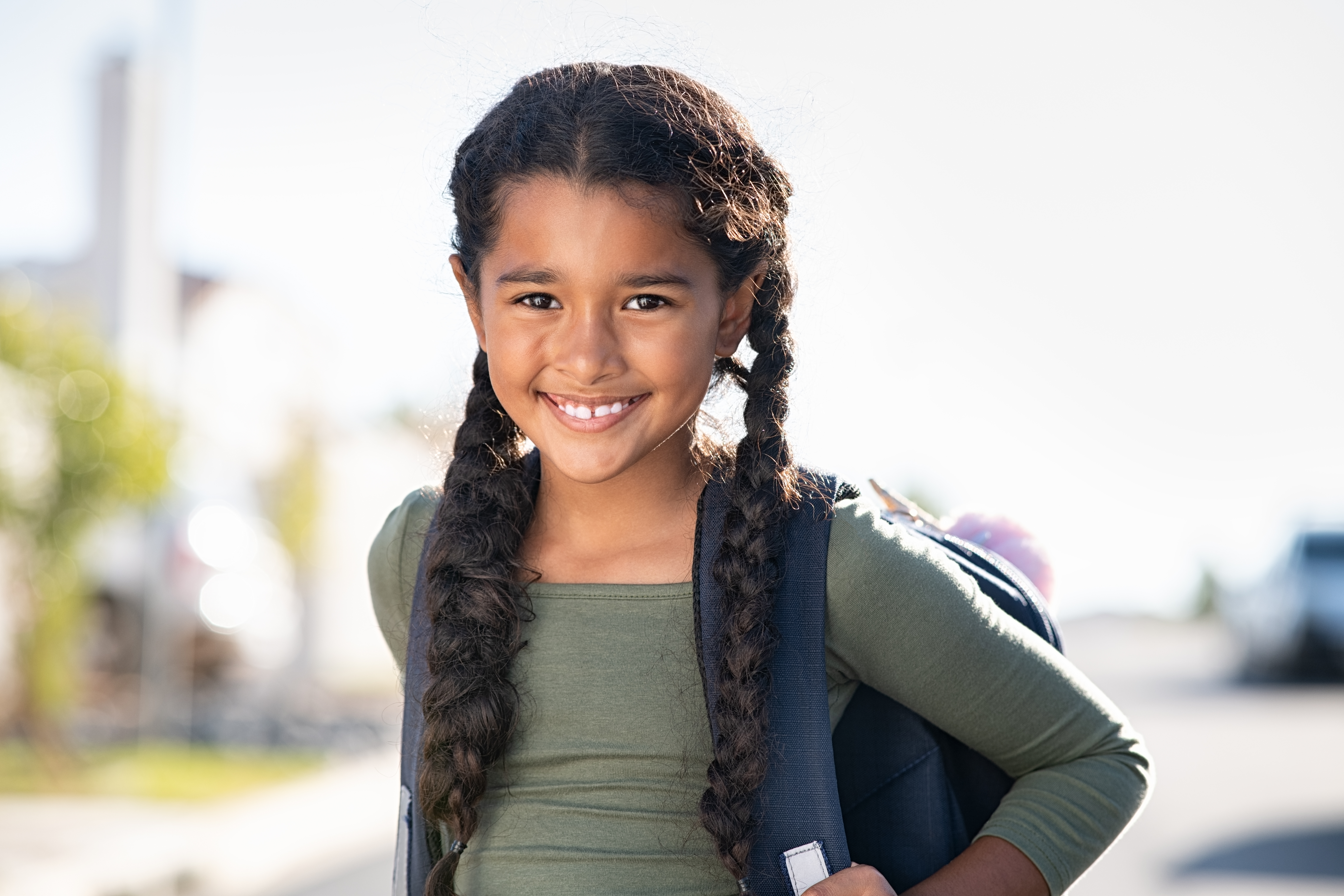 Smiling girl with backpack