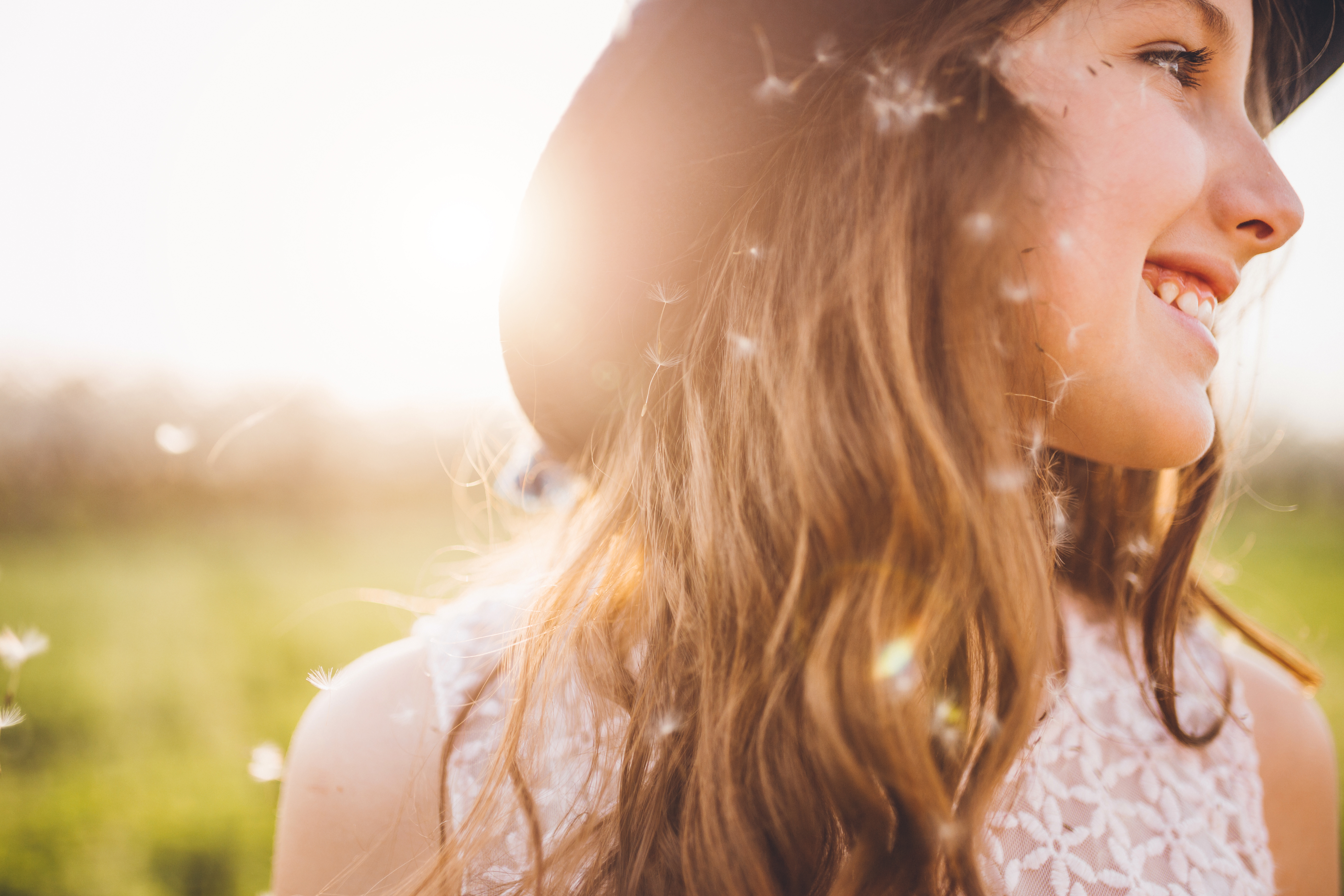 Eighth grade girl in the sun, smiling.