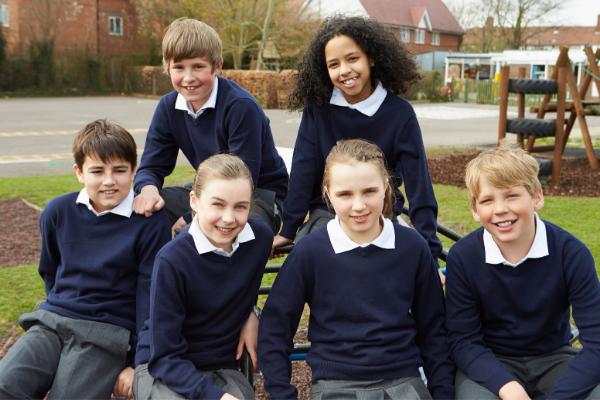 Group of students in uniform outside